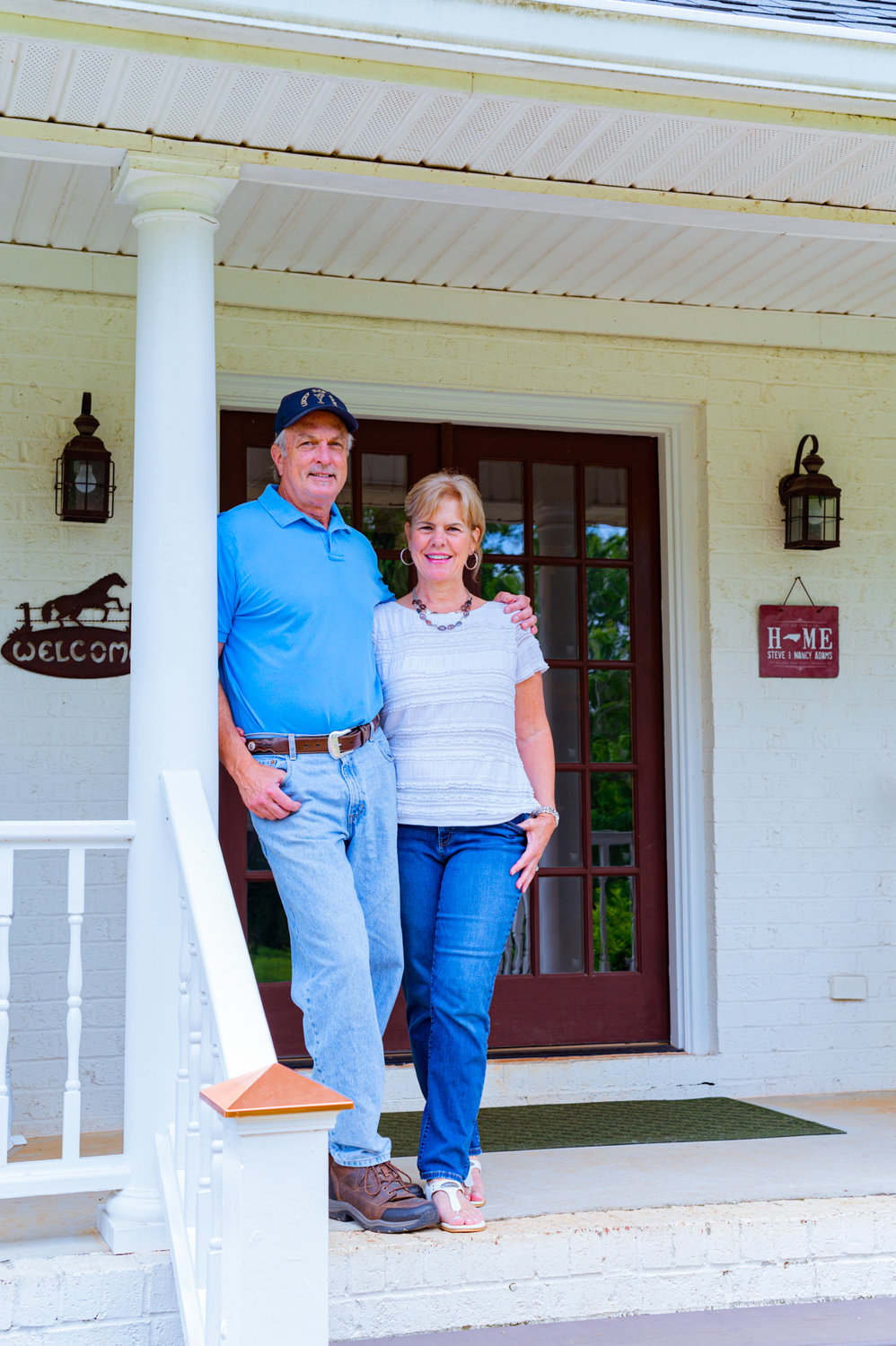 Steve and Nancy Adams stand on their porch at Lucky Bar Farm, a bed and breakfast located in Moncure. Lucky Bar Farm opened in October 2019, making it one of the newer B&Bs in Chatham County.